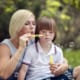 Post 3 - Disabled Boy Blowing Bubbles With Mother