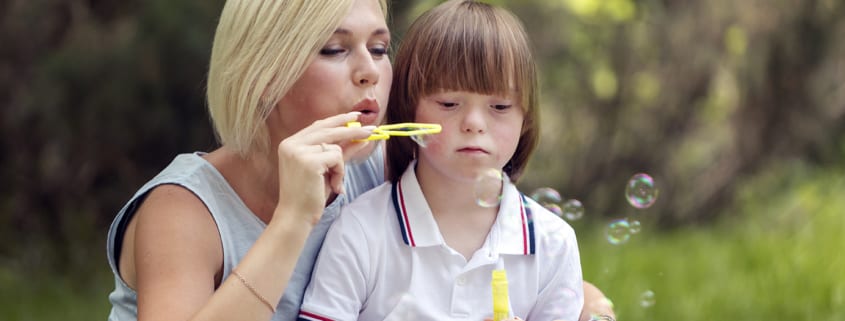 Post 3 - Disabled Boy Blowing Bubbles With Mother